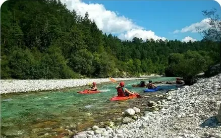 Canoes and kayaks going down a river