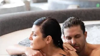 Couple relaxing in a hot tub