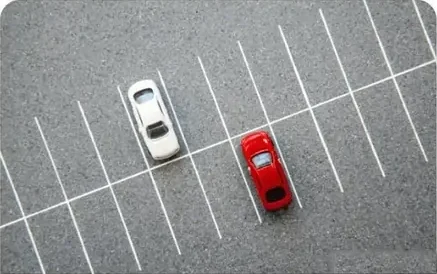 Cars in a parking lot seen from above